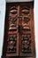 Carving art wooden eyes of wisdom buddha on antique wood door in ancient nepalese architecture and antique old ruin nepali royal