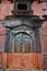 Carving art wooden eyes of wisdom buddha on antique wood door in ancient nepalese architecture and antique old ruin nepali royal