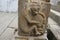 Carving of a monkey holding a fruit on the pillar of the Gommateshwara Temple