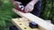 Carving wood plank using hand plane, pov close up