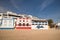 Carvoeiro, Portugal - 10 December, 2016: colorful traditional portuguese architecture houses on sandy beach in blue sky