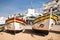 Carvoeiro, Portugal - 10 December, 2016: two wooden traditional colorful beautiful wooden boats for touristic trips to sea caves