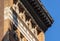 Caryatids and cornice, 19th century brick building, New York