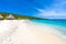 Cas Abao beach - paradise white sand Beach with blue sky and crystal clear blue water in Curacao, Netherlands Antilles, a