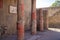 Casa della Gemma in Ercolano with columns. Ruins of ancient roman town Ercolano - Herculaneum, destroyed by eruption of Vesuvius