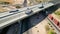 Casa Grande, Arizona, USA- June 22, 2023: An aerial view of truck traffic on a bridge on I-10 spanning a city street and railroad 