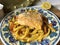 Casarecce pasta with trout in orange marinade.