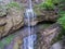 Cascade mountain waterfall. Aerial view.