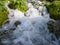 Cascade on Pliva river with bubbly water during sunny day