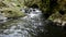 Cascade on small mountain stream, water is running