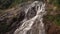 Cascade waterfall in picturesque jungle rainforest
