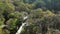 Cascades Amongst Trees At Tropical Mountain Forest. Aerial Drone Shot