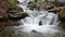 Cascades of pure mountain river among the stones