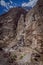 cascades of water flowing from large cracks of rock walls to the river in the canyon of the duck