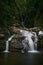 Cascading Fairy Falls surrounded by lush tropical foliage in Australia