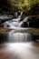 Cascading water through gully into little rock pool