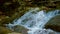 Cascading Water Of Mountain Stream Flowing Down