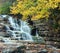 Cascading Waterfall In Autumn