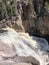 Cascading waterfall down rocks at Yellowstone National Park