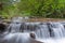 Cascading Waterfall over Ledge at Sweet Creek Falls Trail