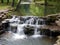 A cascading waterfall on a woodland stream in the Ozarks