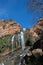 CASCADING WHITE WATERFALL AGAINST ROCK