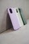 Cases for smartphones. Purple, white and green silicone cases to protect the phone.