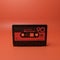 Casette tape isolated on red