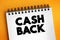 Cash Back - refunds a small percentage of money spent on purchases, text concept on notepad