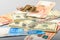 Cash banknotes and coins background. The background of the American and Russian money banknotes and coins.