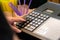 cash register installed on counter for accepting order from customer.sales man entering amount on electronic cash register in