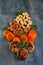 Cashew almonds dried apricots and dried figs in the form of a bouquet of flowers