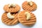 Cashew cookies with cashew nuts on white background