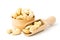 Cashew in wooden plate and spoon on a white background, close-up.