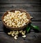 Cashews in a bowl with leaves