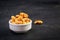 Cashews on dark wooden background. A handful of nuts