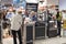 Cashier and customers with face masks due to coronavirus pandemic