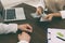 Cashier giving money to businessman at desk in bank