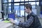 Cashier holds goods in a hand checking price on monitor