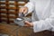 Cashless payment at pharmacy. Cropped close up shot of hands of male unrecognizable pharmacist in lab coat, working at