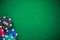 Casino chips on green empty cloth, spotlight background