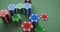 Casino chips over green cloth, closeup