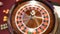 Casino concept. Top view on defocused, blurred roulette in motion, white ball spinning. Bad luck and Good luck concept