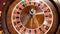 Casino concept. Top view on roulette in motion, white ball spinning. Bad luck and good luck concept. Roulette wheel