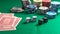 Casino, gambling. Poker chips piles, playing cards and dice on green felt background