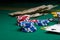 Casino, night life, online gambling business games. Chips, cards and dollars on a green table