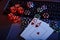 Casino play online theme. Playing chips, cards and dices on laptop close-up