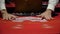 Casino, poker: dealer shuffles the poker cards