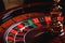 Casino roulette, close-up of a roulette ball, sectors red and black