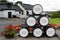 Casks in front of the Auchentoshan Scotch whisky distillery in the Scottish Lowlands